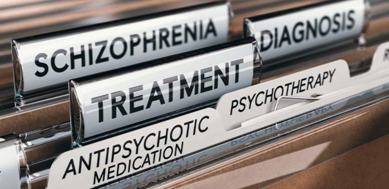 A file folder labelled "Schizophrenia Treatment"